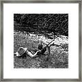 Boy Fishing With Hat Over Face Framed Print