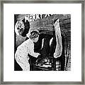 Boy Looking At Boots In Fireplace Framed Print