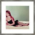 Brigitte Bardot Reclining On Bed Framed Print