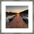 Canoes On The Dock At Sunrise Framed Print