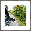 Car Driving Along A Country Road Framed Print