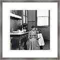 Child Watches Mother In Kitchen Framed Print