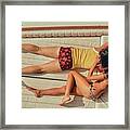 Couple Lying Face Down On A Boat Framed Print