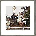 Couple On Tennis Court, Woman Jumping Framed Print