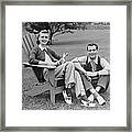 Couple Sitting Outdoors Framed Print