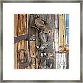 Cowboy Boots And Hat Hanging On Cabin Framed Print