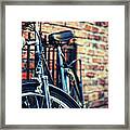 Cruiser Leaning Against Brick Wall Framed Print