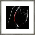 Disposed Red Wine Glass And Bottle Framed Print