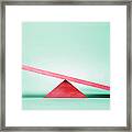 Empty Red Seesaw On Green Background Framed Print