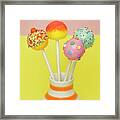 Four Differently Coloured And Decorated Cake Pops For A Party Framed Print