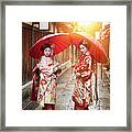 Geisha Girls Holding Red Umbrellas Framed Print