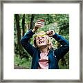 Girl Looking Through A Magnifying Glass At Bugs In The Forest Framed Print