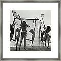 Girls Playing La Crosse On Beach Framed Print