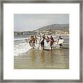 Group Of Surfers Running In Water With Framed Print