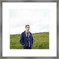Guy In A Blue Jacket With A Camera In The Middle Of The Mountains Framed Print