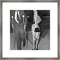 John F. Kennedy On Crutches With Wife Framed Print