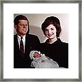 John F Kennedy With Jackie Holding Son Framed Print