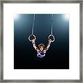 Male Gymnast Performing On Rings Framed Print