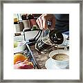 Man Pouring Coffee Into A Cup From A Framed Print