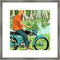 Man Riding A Motorcycle By A Lake Framed Print