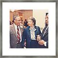 Men And Woman Talking At A Party Framed Print