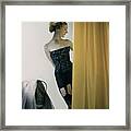 Model Changing Behind A Yellow Curtain Framed Print