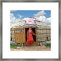 Mongolian Girl Stepping Out Of Her Yurt Framed Print