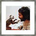 Monkey Feeding Paralyzed Man Framed Print