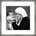 Mother Teresa With A Baby Framed Print