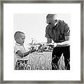 Neil Armstrong Plays With Son Framed Print