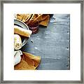 Overhead View Of Rustic Metal Table With Plate Of Fresh Bread And Red Wine Framed Print