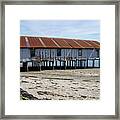 Pilings And Rusty Roof Framed Print