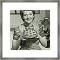Portrait Of Mature Woman Holding Pie Framed Print
