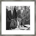 President John F. Kennedy Signs Framed Print