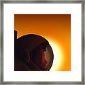 Profile Of A Helmeted Astronaut Against Framed Print