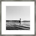 Pulled Back View Of A Female Surfer Riding Small Wave, Black And White Framed Print