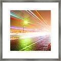 Rainy Road With Blurred Traffic At Night Framed Print