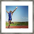 Runner Crossing Finish Line Framed Print