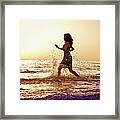 Running Into The Sea At Sunrise Framed Print