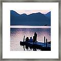 Sitting On A Jetty On The River At Framed Print