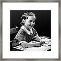 Smiling Young Girl Reading Book Framed Print