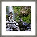 Stone Cairn With Distant Waterfall Framed Print