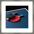 Table Tennis Bats And A Ball On A Table Framed Print