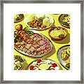 Tabletop Of Platters And Bowls Of Food Framed Print