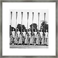 Teammates Posing With Oars On Dock Framed Print