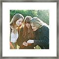 Teenage Girls Admiring Something Framed Print