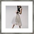 The Coquetry. A Young Ballerina In A Black Skirt And Chopin Is Standing On Pointe Shoes Framed Print