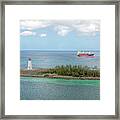 The Lighthouse And The Freighter Framed Print