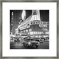 Traffic And Stores In Times Square Framed Print