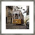 Tram And Motorbike In Lisbon Framed Print